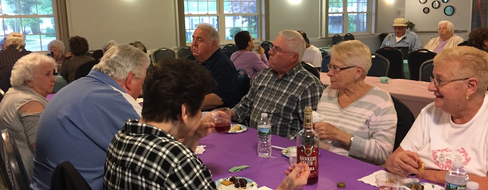 Summerflied Friendly Village MHOA Welcomes Summer Neighbors Eating Together