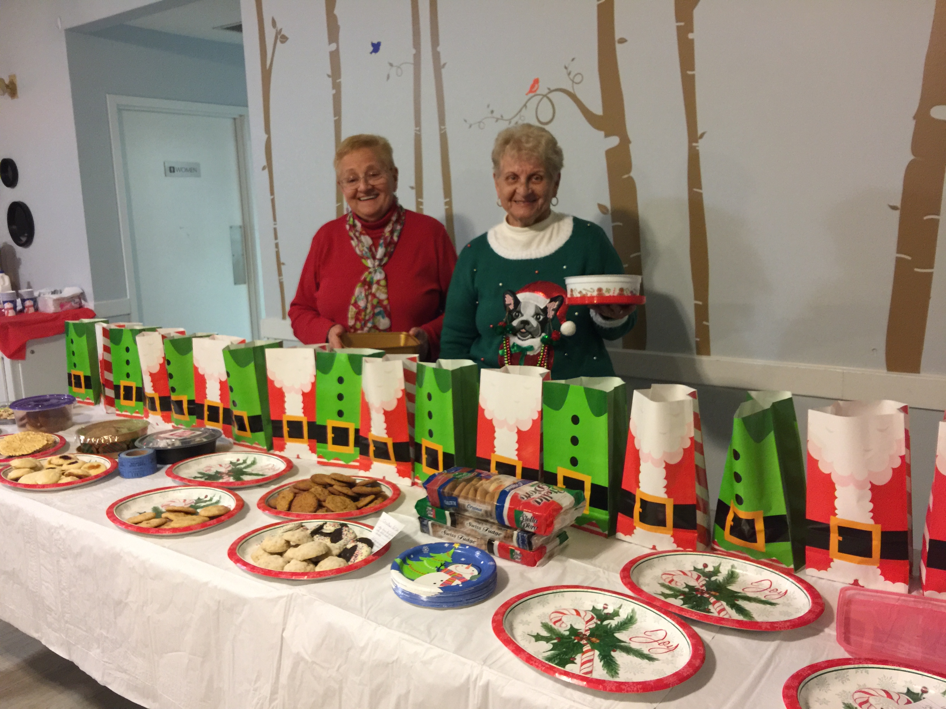 Elves helping to fill the bags with cookies